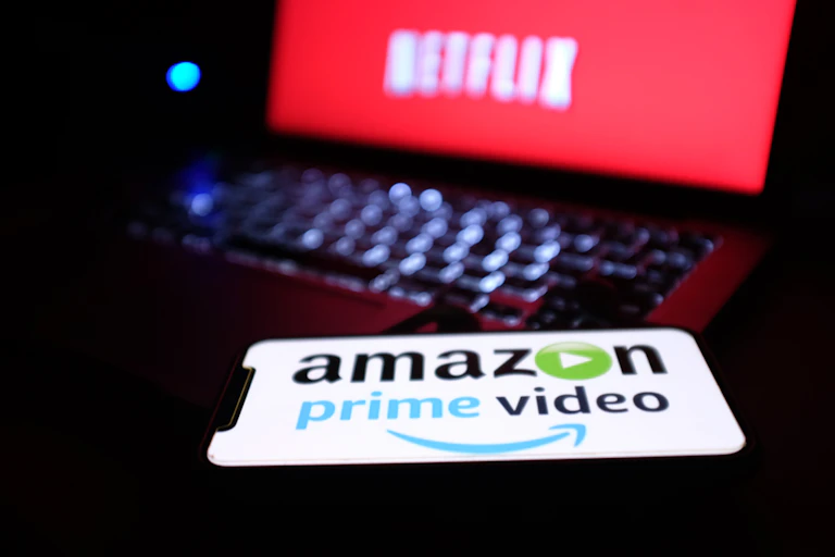 Two screens with Amazon and Netflix logos.