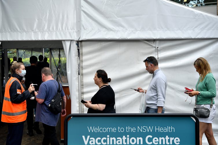 People line up for vaccination at a Sydney hub.