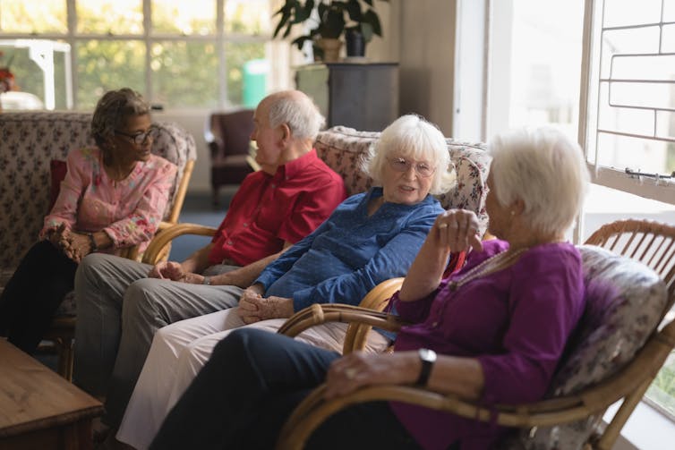 Four older adults sitting