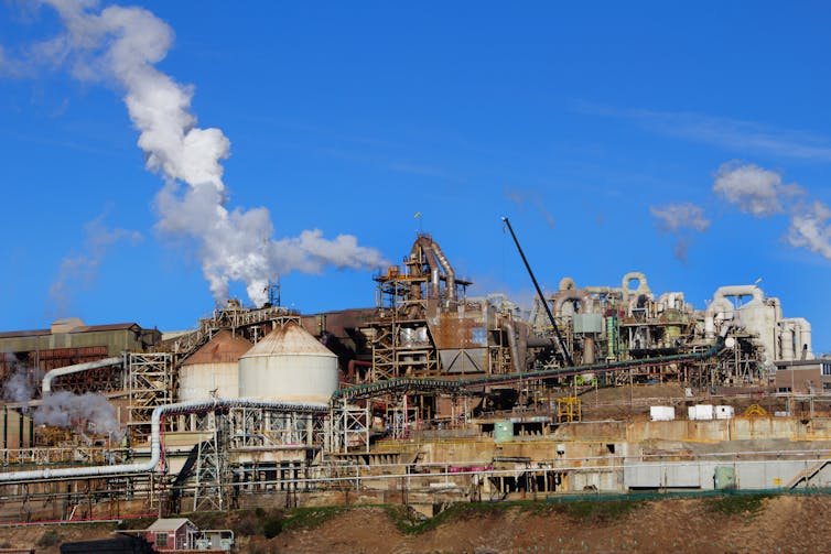 Industrial plant billowing smoke