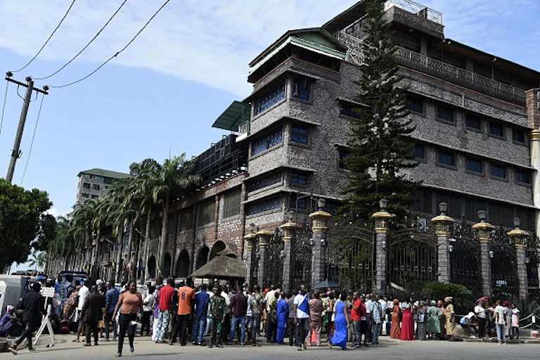 Crowd of people outside a multistorey building