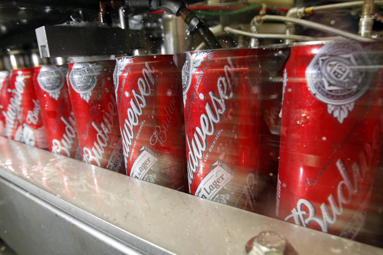 Budweiser cans on a factory line.