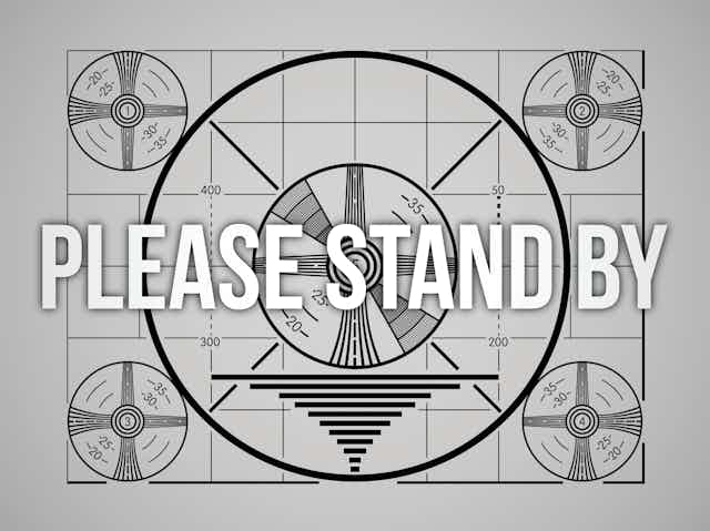 Television test pattern with the words please stand by