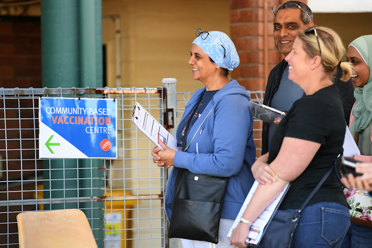 People in Brisbane line up to be vaccinated.