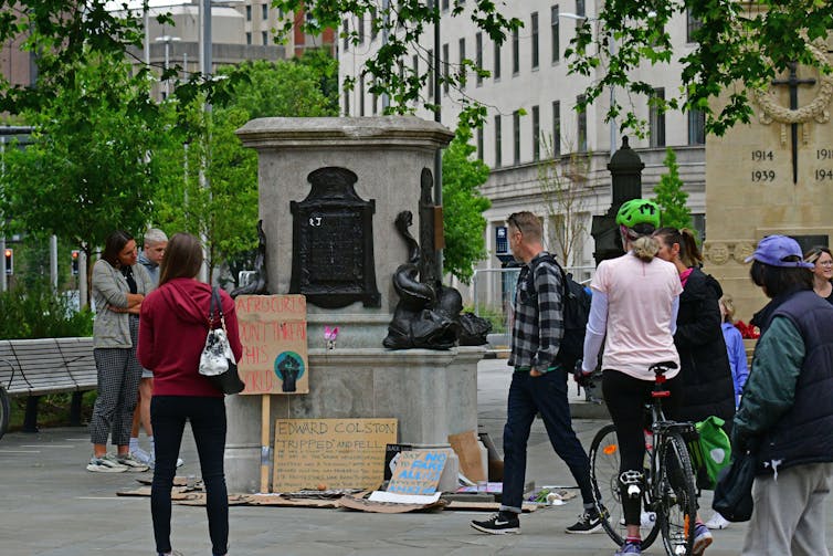 Crowd gathers in front of empty plinth where Bristol's Edward Colston statue once stood