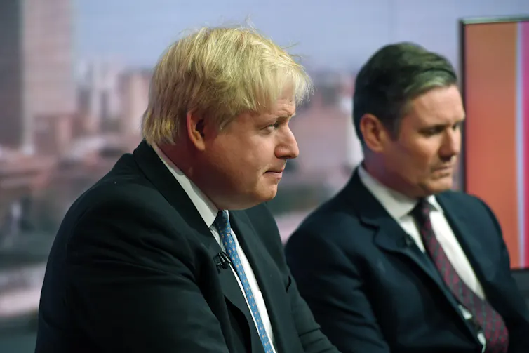Boris Johnson and Keir Starmer sat next to each other in a TV studio
