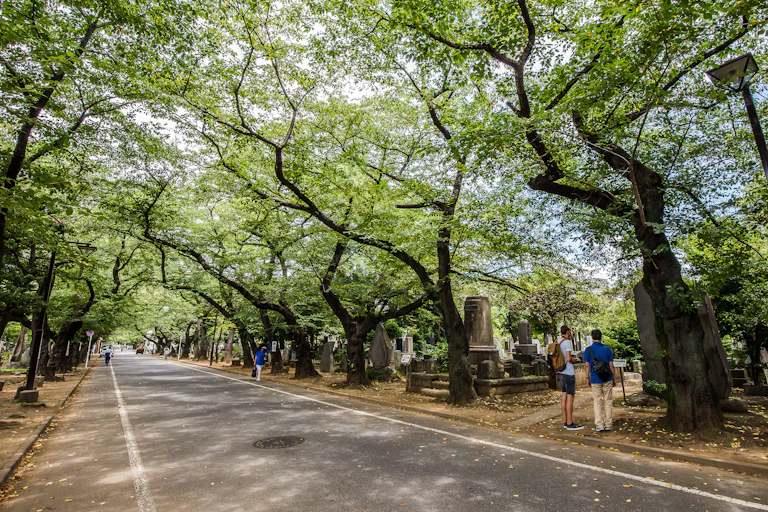 People at the grave sites of their loved ones in Yanaka Cemetery, Tokya, Japan.
