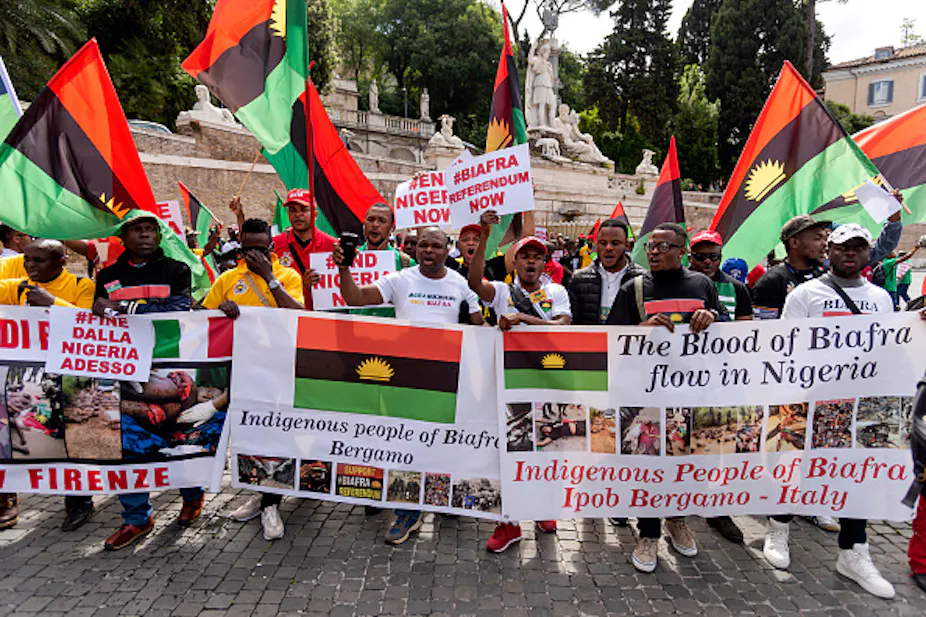 Protesters holding flags and banners.