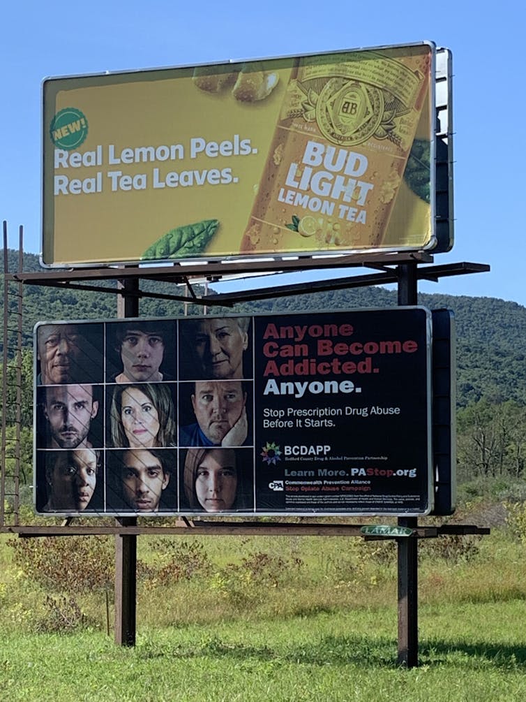 Highway billboard in Pennsylvania with diverse peoples' faces and the message, 'Anyone can become addicted. Anyone. Stop prescription drug abuse before it starts.'