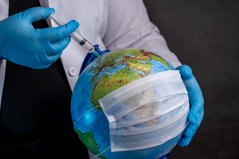 A globe is injected with a syringe.