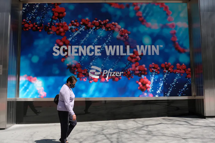 Pfizer HQ sign reads 'Science Will Win'.
