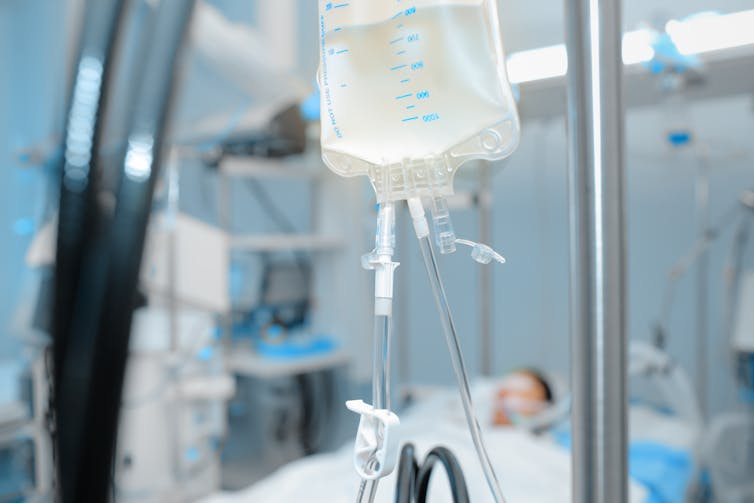A patient on an intravenous drip in hospital