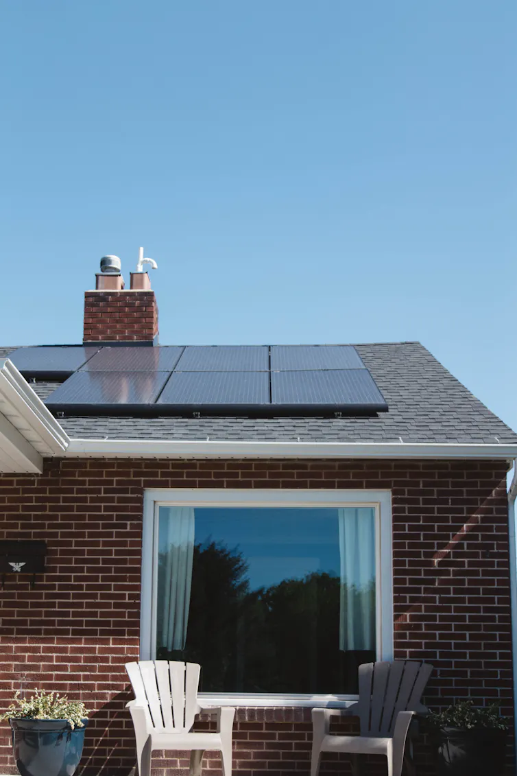 A house with solar panels mounted on its roof