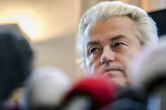 Geert Wilders with a microphone in the foreground