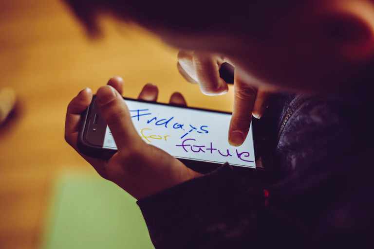 Person writes 'Fridays for future' on their phone