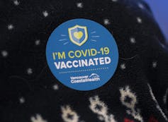 A sticker reading 'I'm COVID-19 vaccinated' from Vancouver Coastal Health