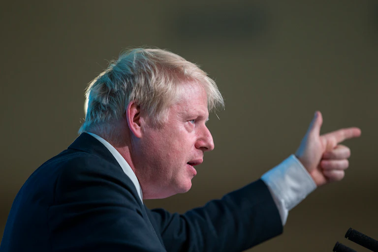Boris Johnson pointing upwards