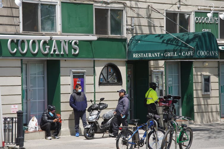 People congregate outside Coogan's restaurant.