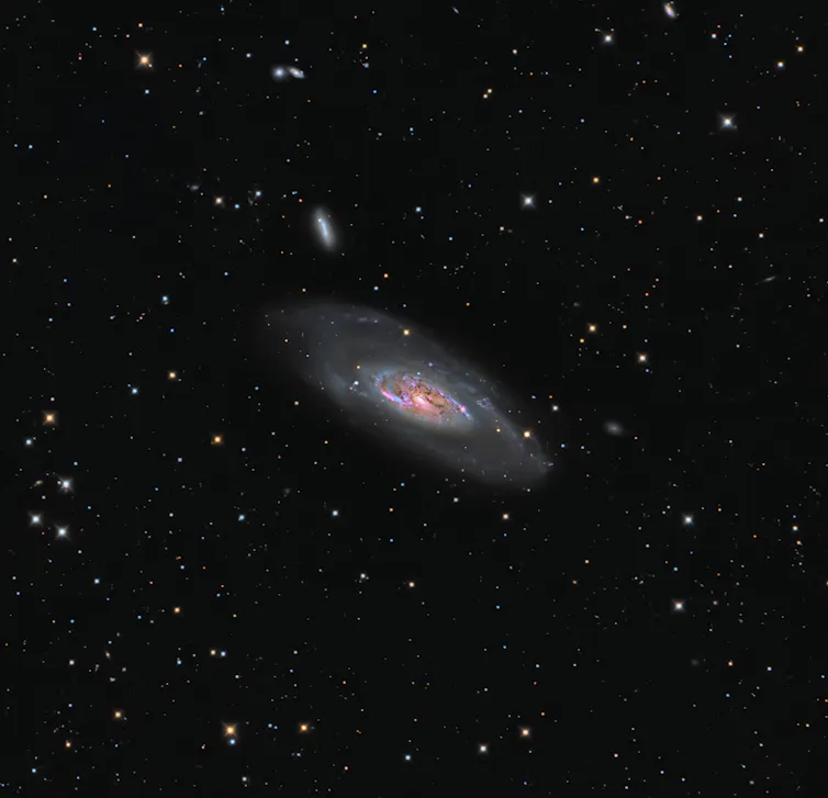 An image showing detail of one galaxy, but visually implying there are many more.
