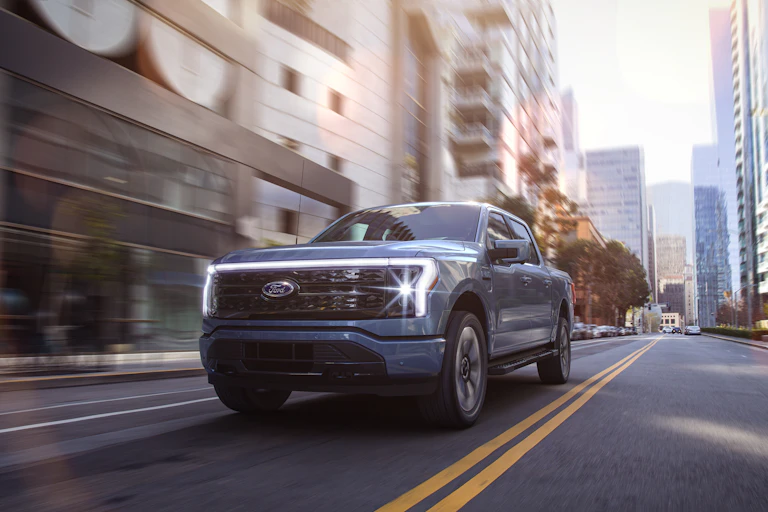 Digital rendering of F-150 driving down an urban boulevard.
