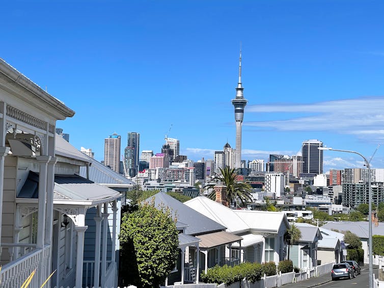 inner city houses in Auckland with Sky Tower in distance