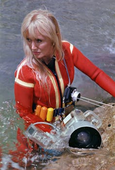 blonde woman in bright scuba suit