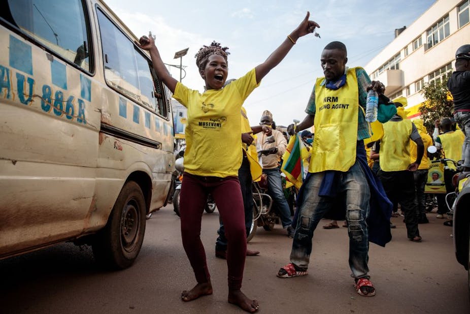 A woman celebrated following the re-election of President Museveni