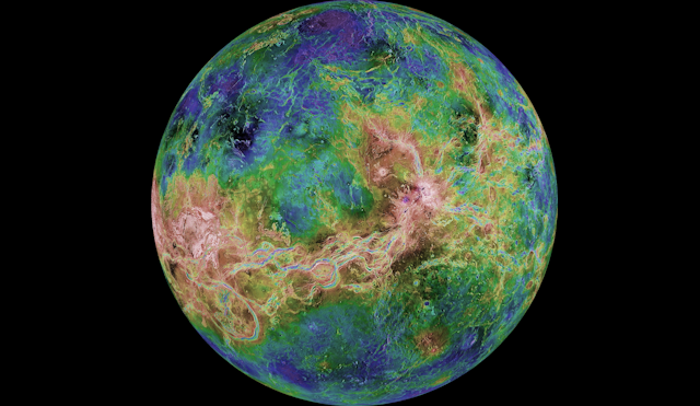 A radar image of Venus showing reds, blues and greens relating to elevation.