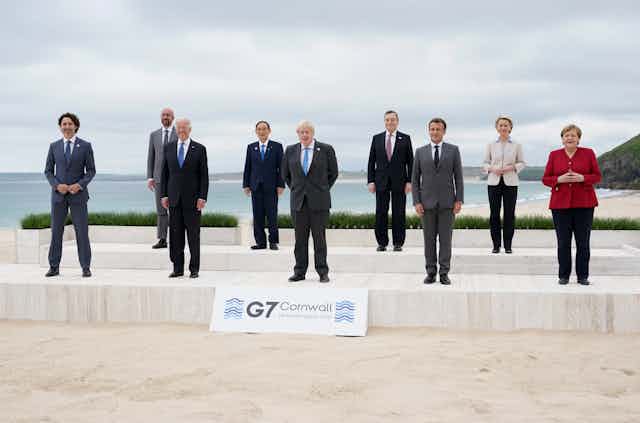 Leaders pose on a Cornwall beach at the G7 meeting