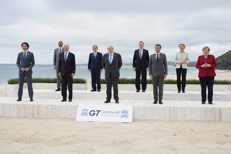 Leaders pose on a Cornwall beach at the G7 meeting