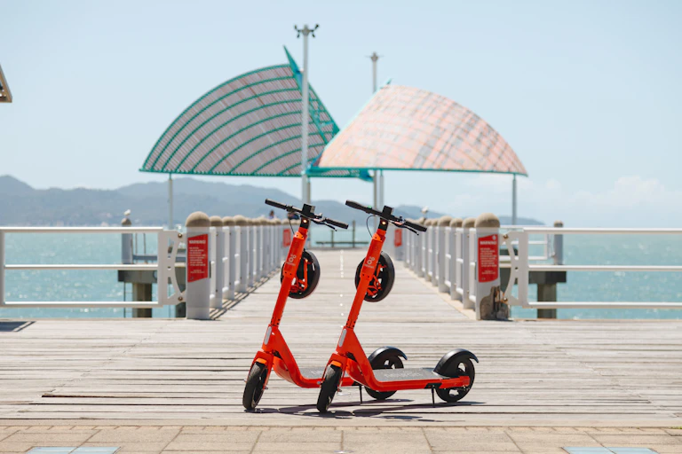 For hire e-scooters parked at the Strand, Townsville ready to be booked