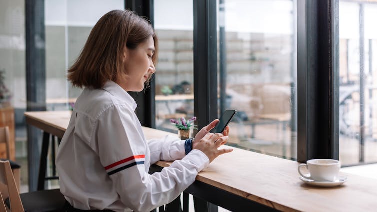 A woman texting on her phone