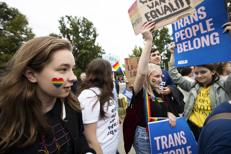 Students holding banners supporting equality for LGBTQ people on Oct. 8, 2019, in Washington D.C.