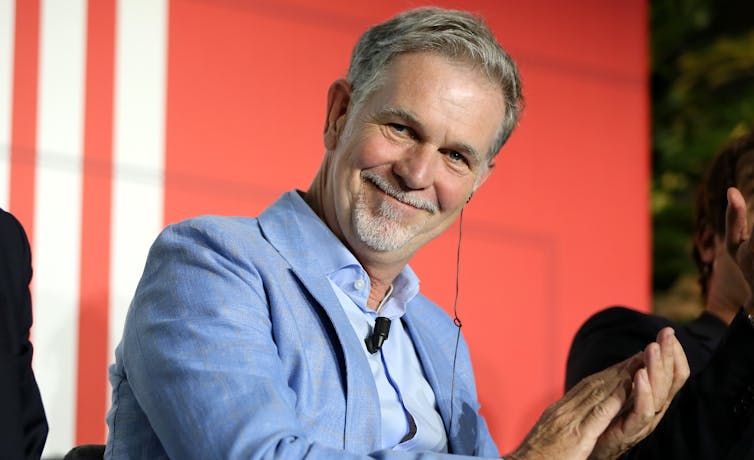 Netflix founder Reed Hastings applauds