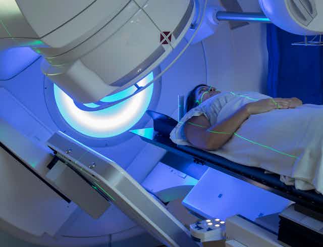 A woman receiving radiation therapy for cancer