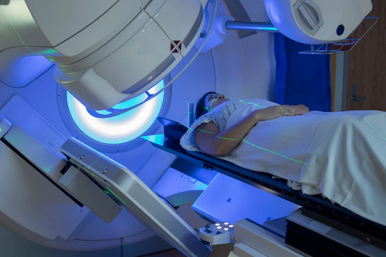 A woman receiving radiation therapy for cancer
