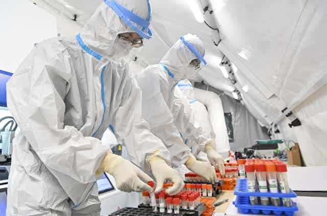 People working in a high-security laboratory