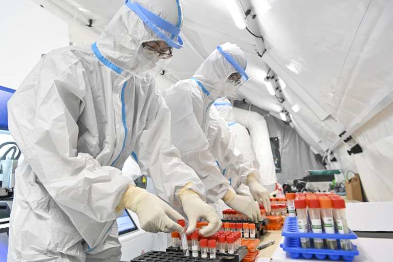 People working in a high-security laboratory
