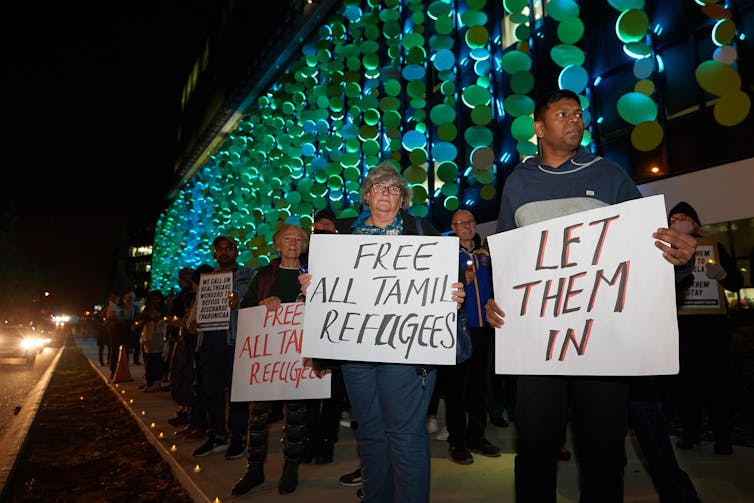 Protesters keep a vigil outside the Perth hospital treating Tharunicaa Murugappan.