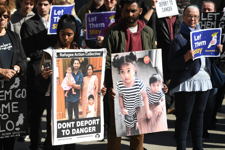 Refugee advocates protest to let the Biloela Tamil family stay in Australia.