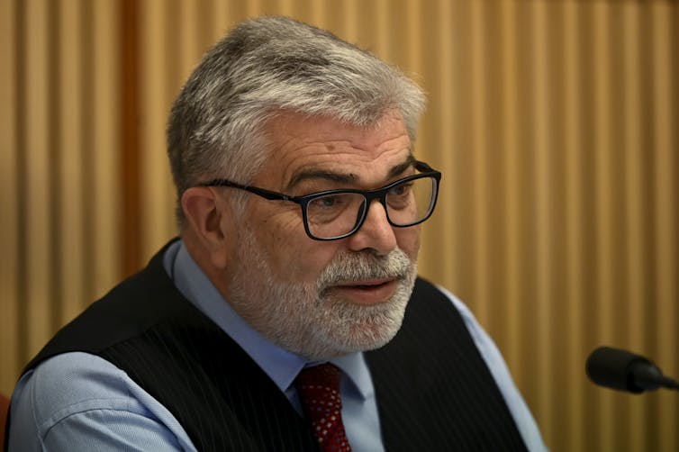 Man asks a question in hearing