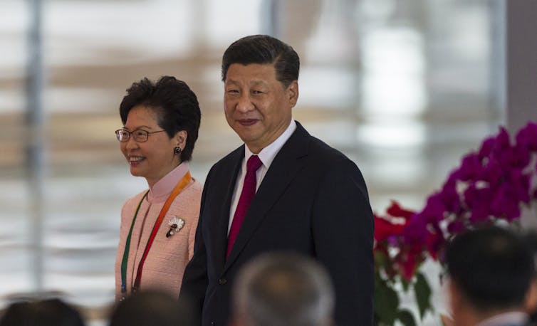 Chinese president Xi Jinping walks with Hong Kong's chief executive Carrie Lam in Guangdong province, China, October 2018.
