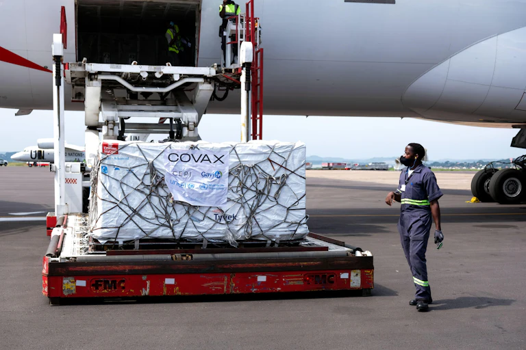 AstraZeneca vaccines from Covax vaccine sharing programme being unloaded from a plane at Entebbe International Airport, Uganda