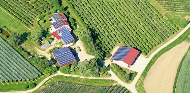 Aerial view of houses with solar panels