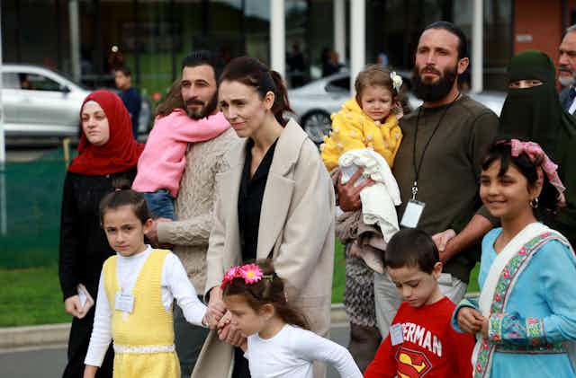 Jacinda Ardern with refugee children