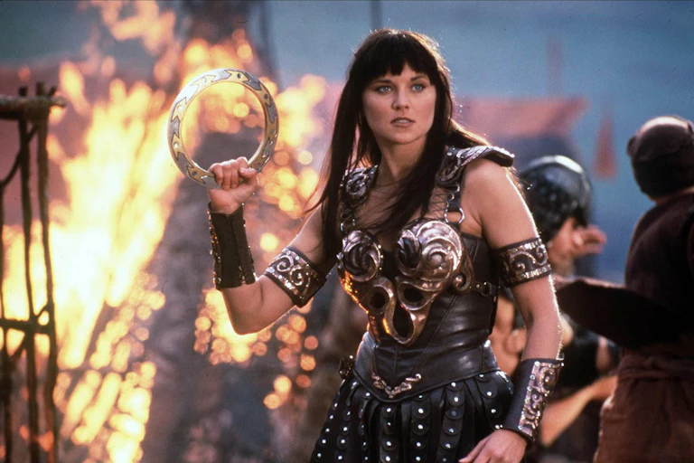 Lucy Lawless in a battle dress.