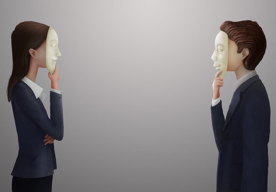 Man and woman in business attire with masks on