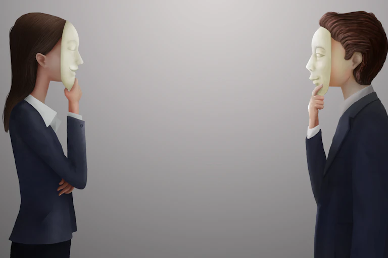 Man and woman in business attire with masks on