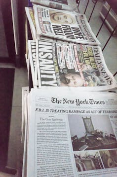 Stacks of newspapers.