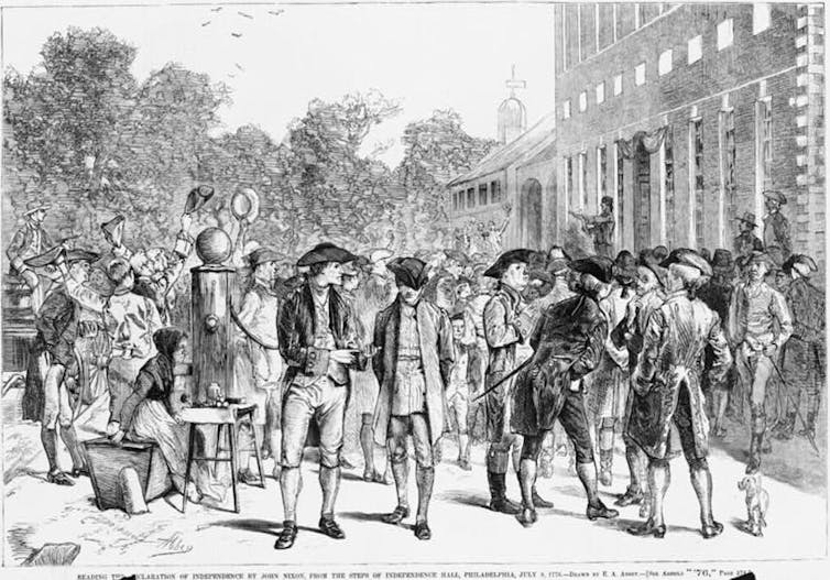 A woodcut of people in colonial dress gathered in the street